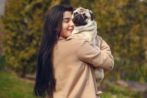 A woman enjoying her day with her lovely pet. CBD oil in Mobile