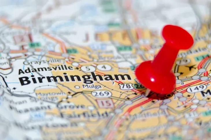 a red push pin on a map of Birmingham, Alabama
