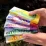 Colorful vape boxes held in hand