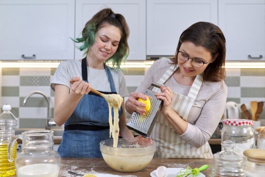 Mother and daughter cooking