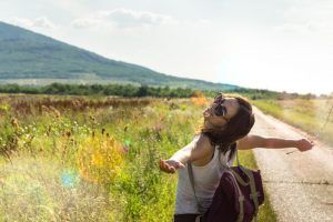 A woman having a nice walk in a field in Athens, GA.