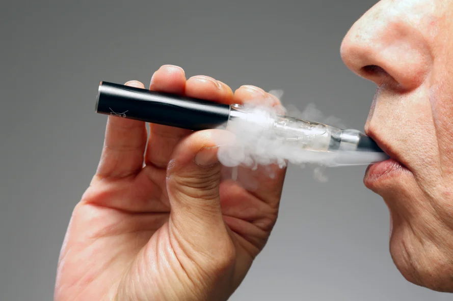 Person vaping with a one-hitter