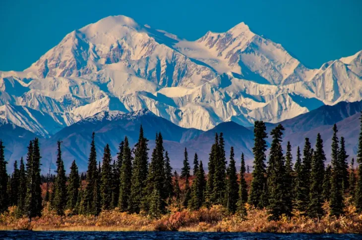 Alaska's snowy mountain range in the distance