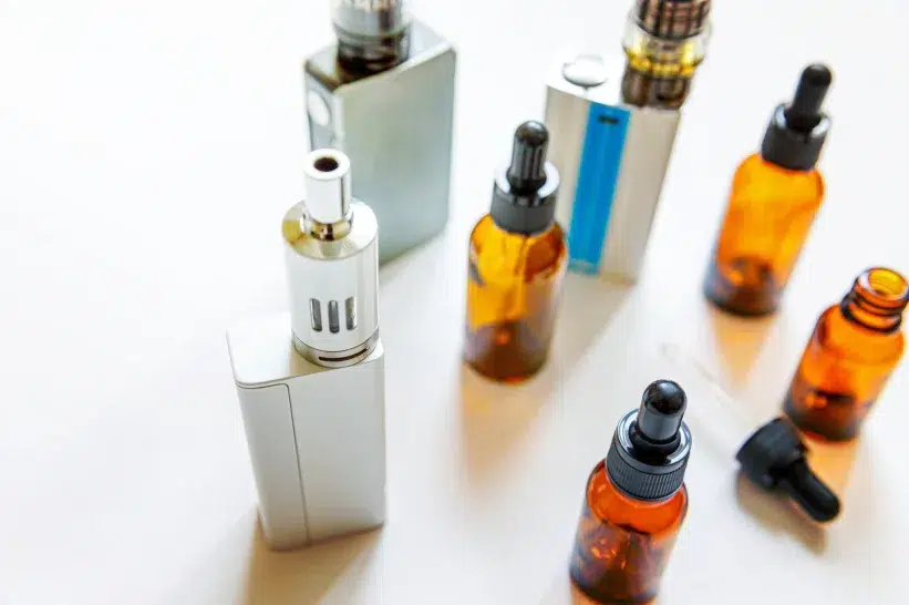 a group of different colored vapes