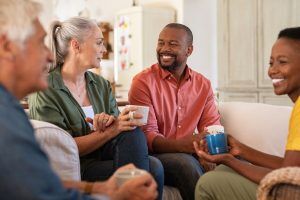 A family having a great time over a cup of coffee. CBD Oil in Greenville, SC