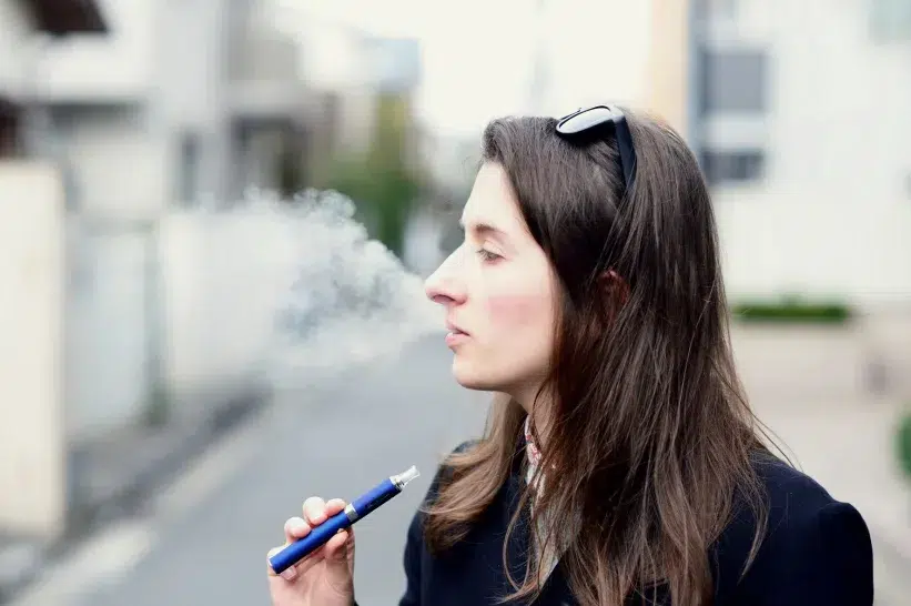 a woman vaping