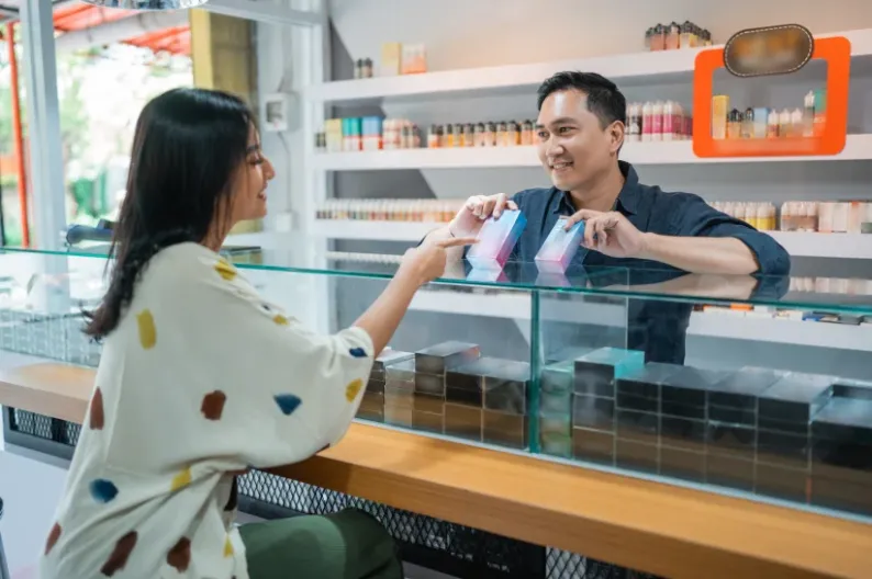 a budtender and a customer inside a vaping shop in Oklahoma